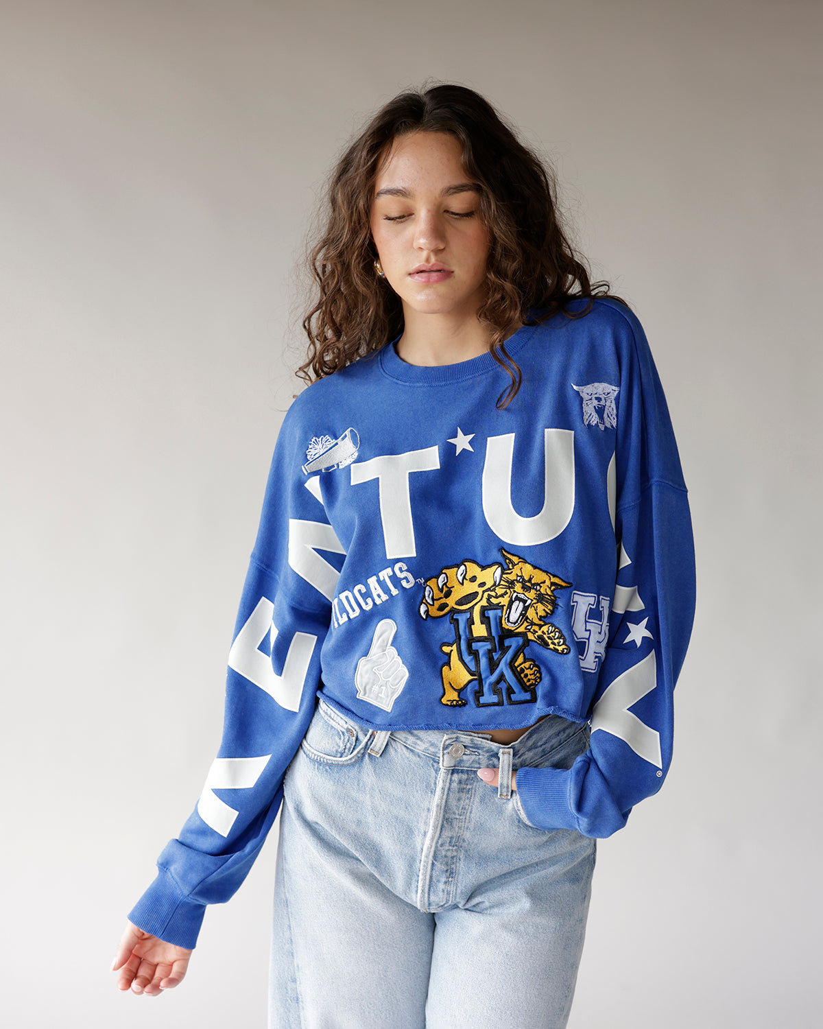 Blue Kentucky Wildcats cropped crewneck sweatshirt with bold graphics and logos