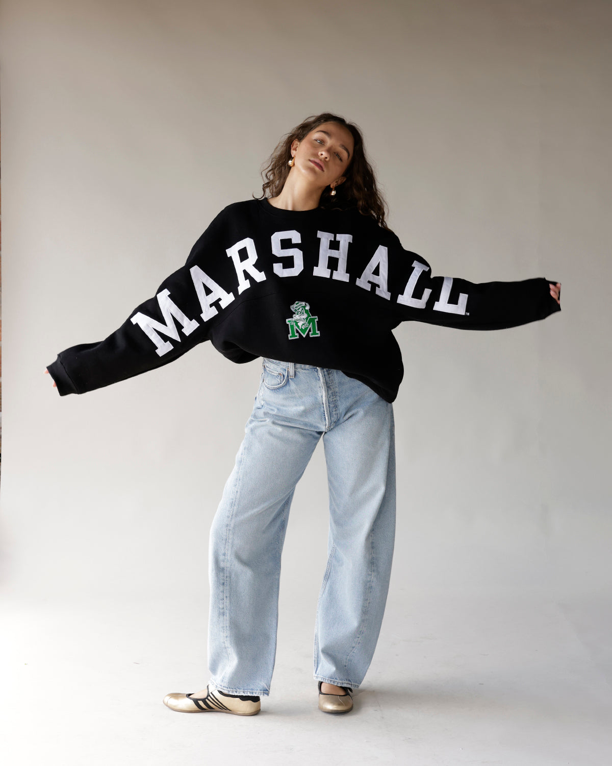 Black Marshall varsity crewneck sweatshirt with bold white lettering and green logo