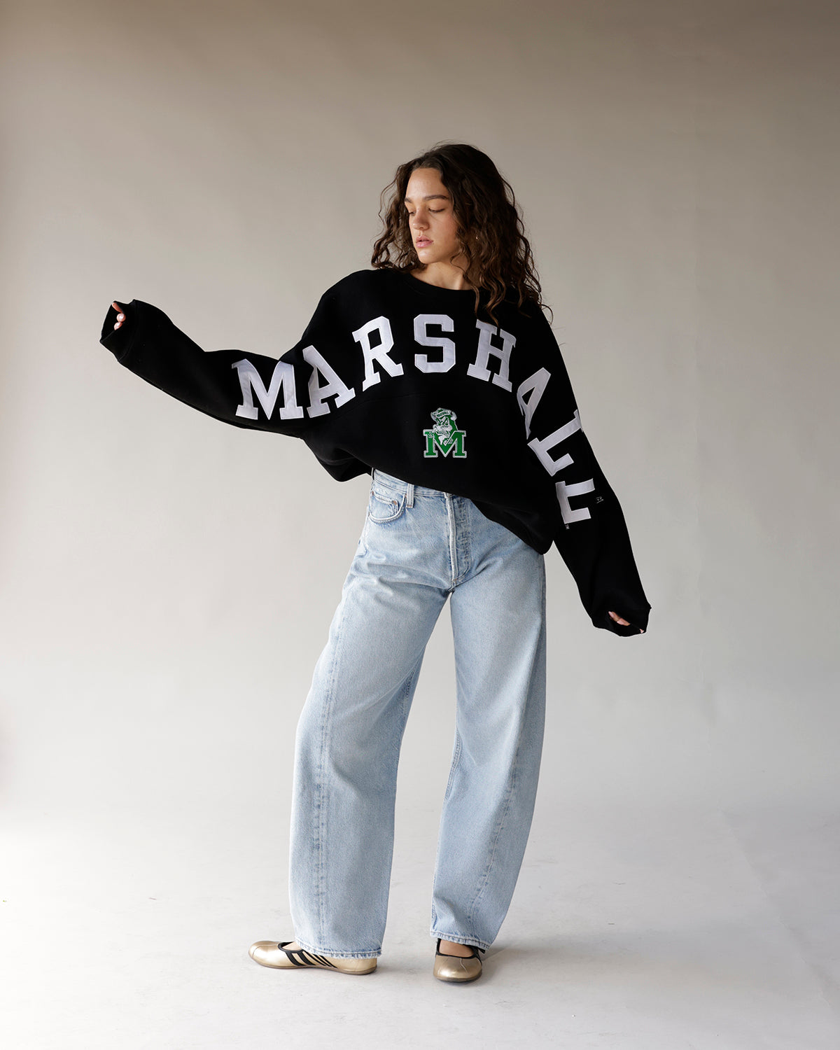 Black Marshall varsity crewneck sweatshirt with white arch lettering and green M logo