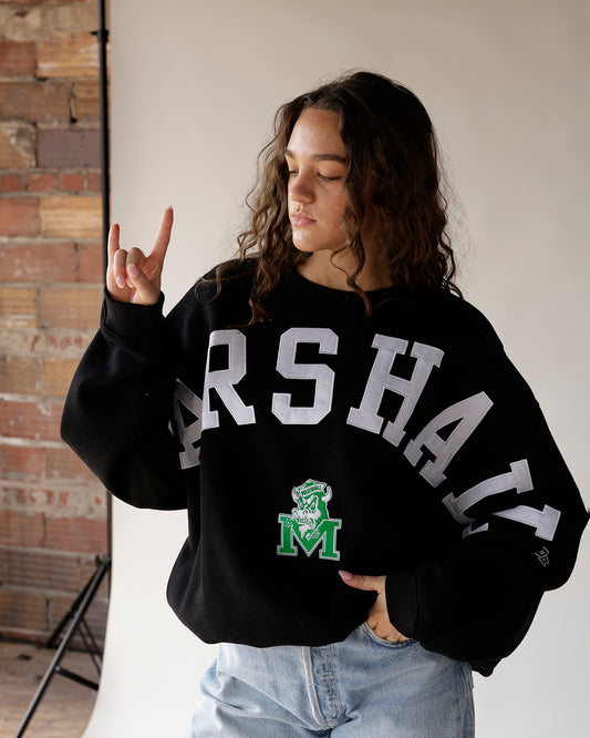 Black Marshall varsity crewneck sweatshirt with white lettering and green mascot logo