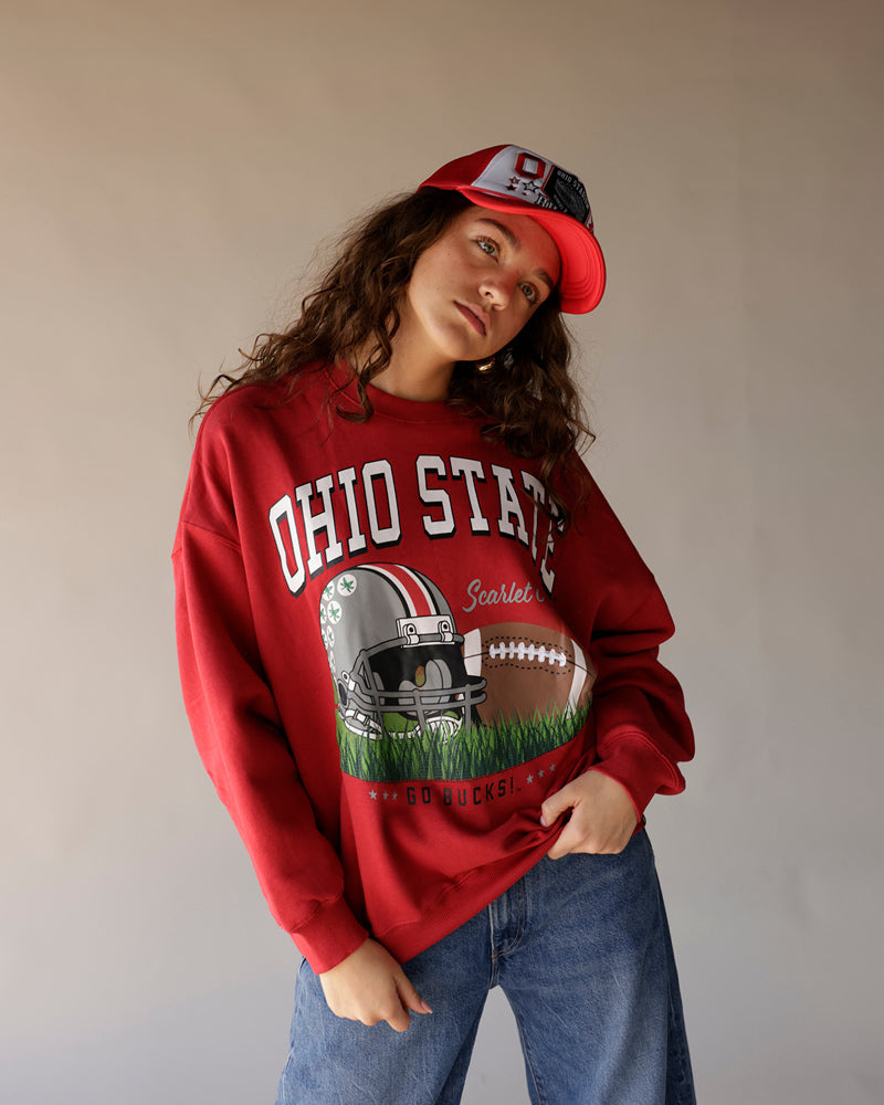 Women's red Ohio State Buckeyes crewneck sweatshirt with football graphic and cap