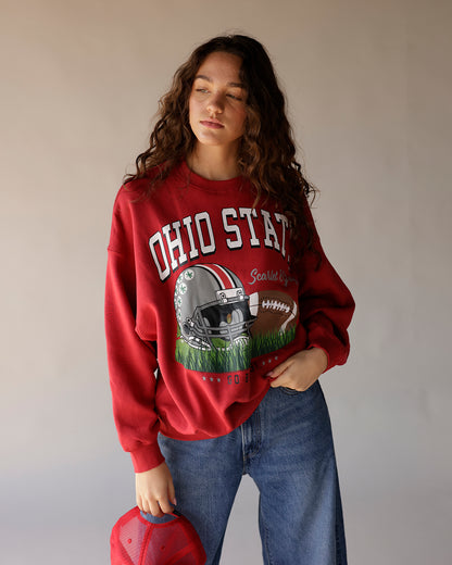 Faded red vintage Ohio State crewneck sweatshirt with football graphic print