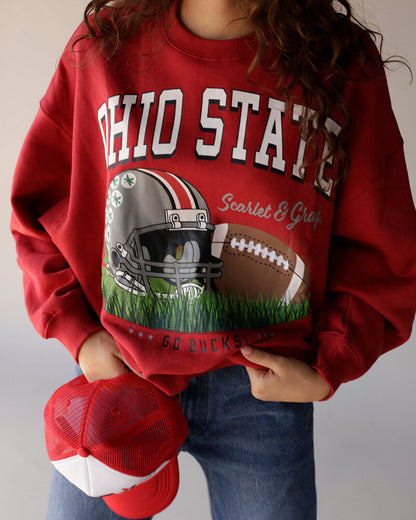 Women's red Ohio State Buckeyes crewneck sweatshirt with football graphic and cap