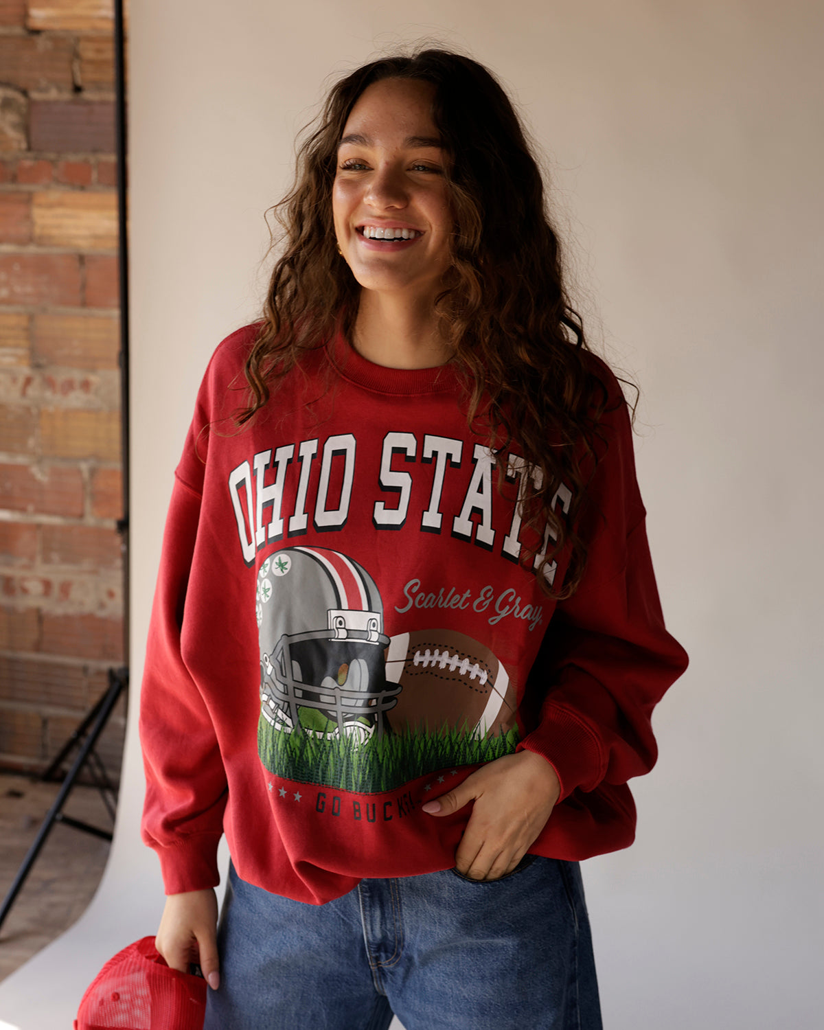 Red vintage Ohio State Buckeyes crewneck sweatshirt with football graphic design