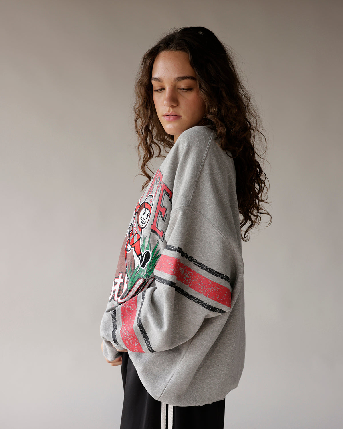Oversized gray Ohio State crewneck sweatshirt with vintage graphic and striped sleeves