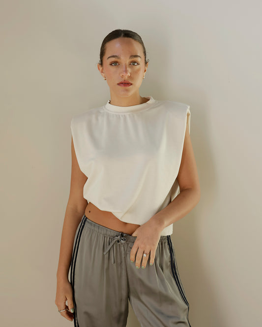 shop the elle grey ivory sleeveless top featuring structured statement shoulders, a relaxed silhouette and crew neckline. your new favorite elevated basic.