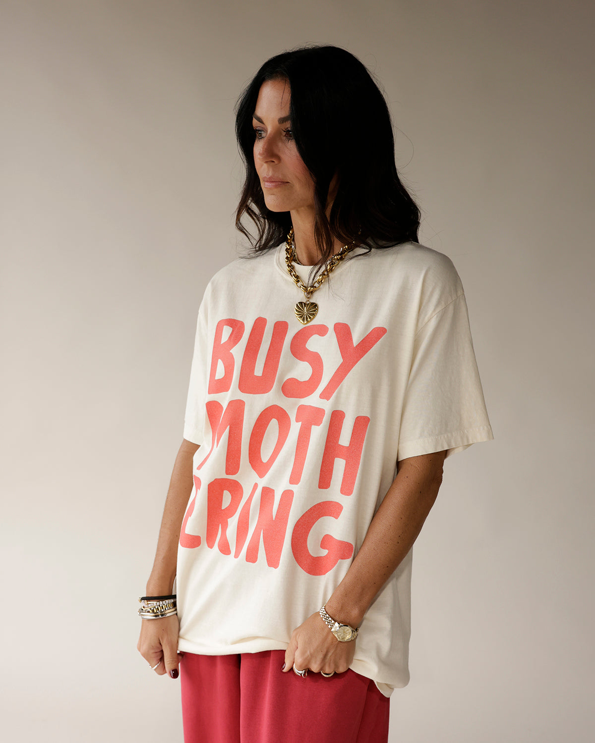 Oversized cream graphic tee with bold coral BUSY MOTHERING print by Salty Babe Threads