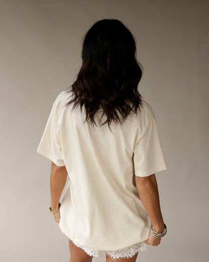 Cream oversized graphic tee back view, drop shoulders, short sleeves