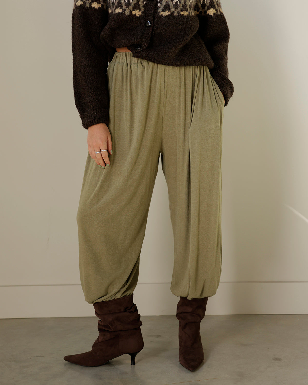 mimosa olive green balloon pants with an elastic waistband, relaxed draped silhouette and gathered ankle hems, styled with chocolate brown boots.