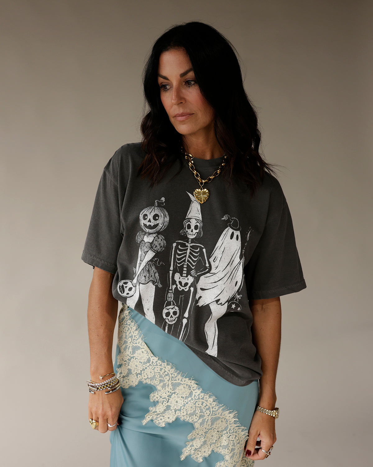 Dark gray oversized graphic tee with vintage Halloween skeleton, ghost, and pumpkin print