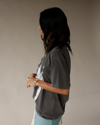 Oversized charcoal gray Halloween graphic tee with white figure print, side view