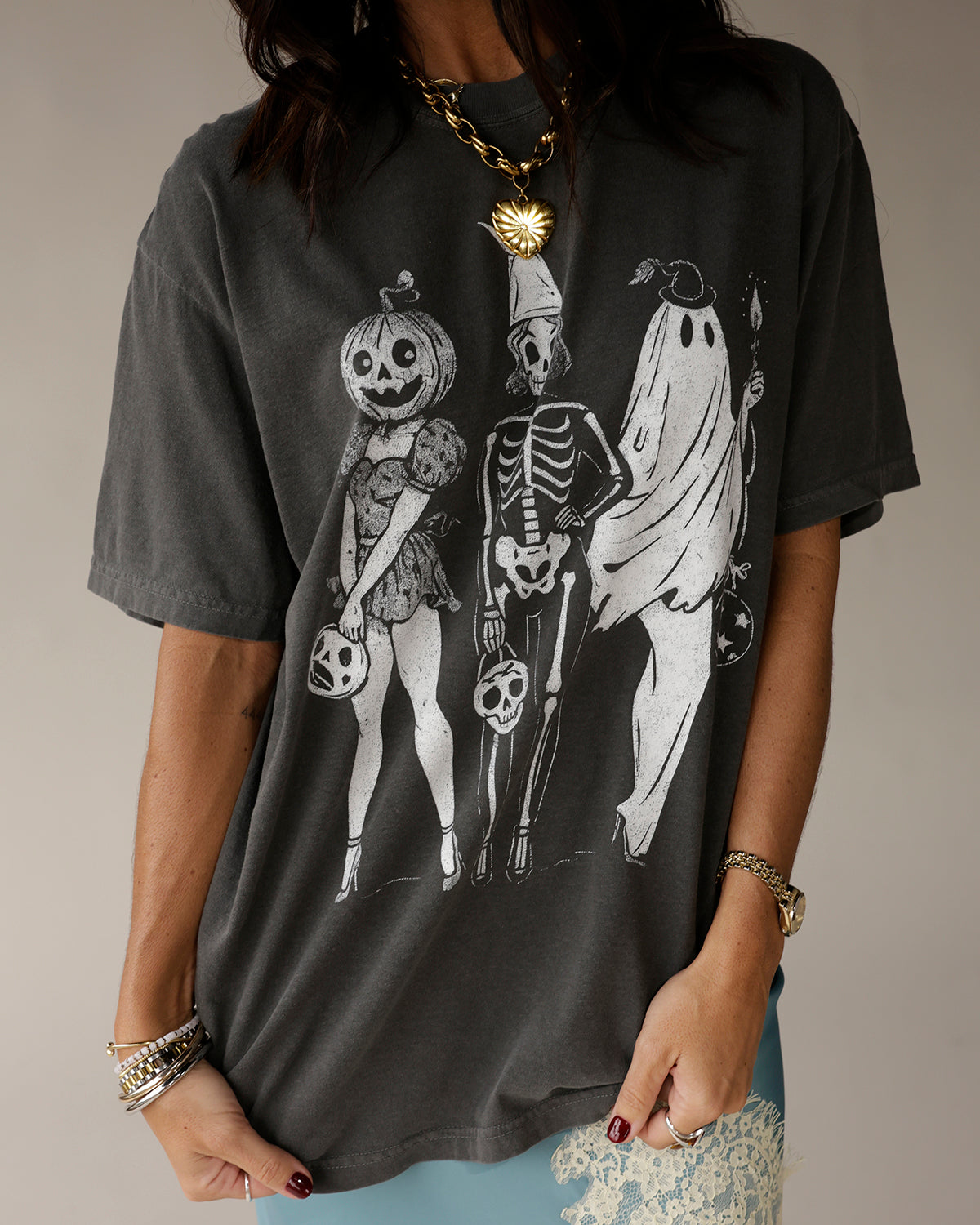 Charcoal gray oversized graphic tee with Halloween pumpkin skeleton ghost trio print