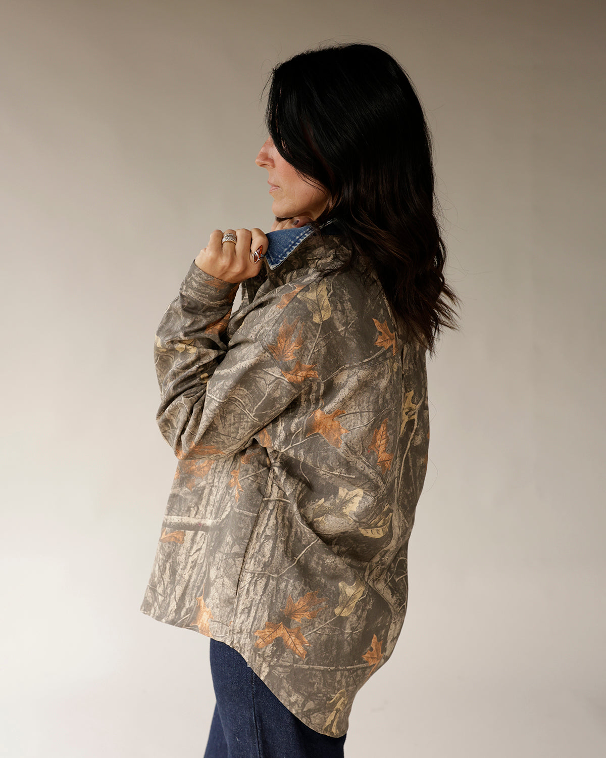 Women's oversized Realtree camo shirt jacket with denim collar, back view