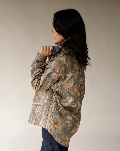 Women's oversized Realtree camo shirt jacket with denim collar, back view