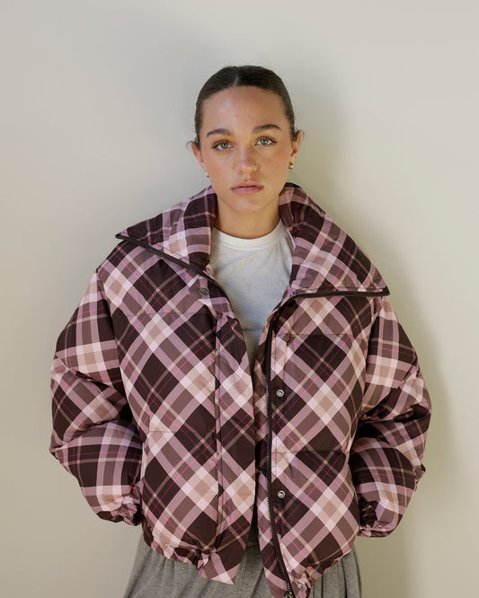 women's TCEC chocolate brown and blush pink plaid puffer jacket featuring an oversized silhouette, high stand collar, zip and snap front, and gathered cuffs.