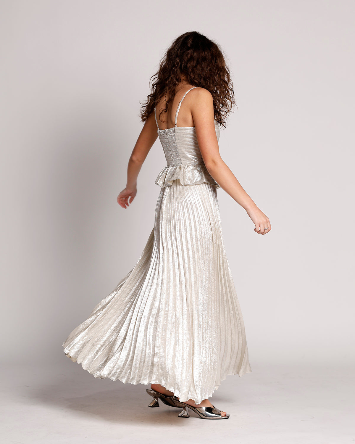 LUNAR GLOW PEPLUM PLEATED MAXI DRESS