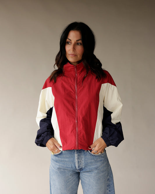Red, cream, and navy colorblock zip-up windbreaker jacket with mock neck