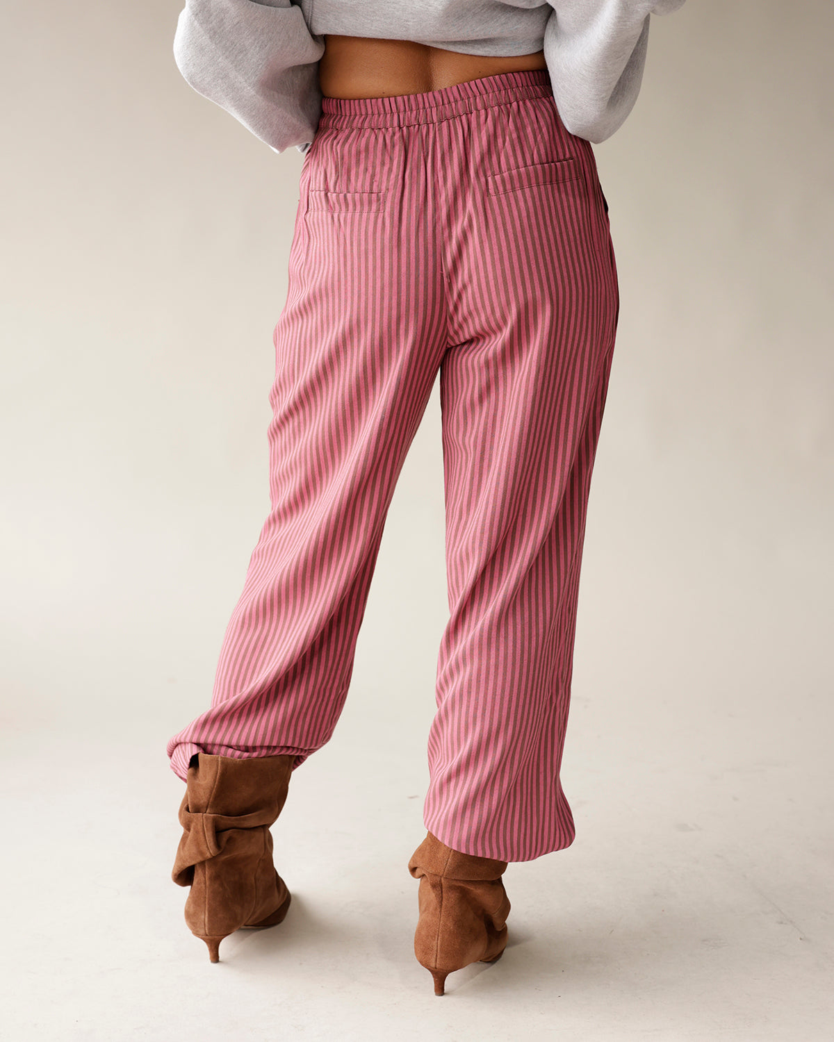 Pink and gray striped wide-leg dressy pants with elastic waistband and back pockets