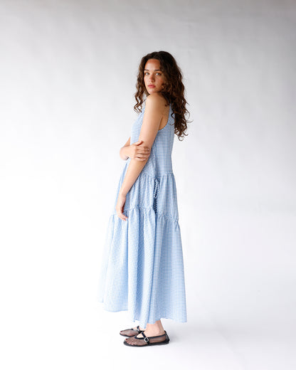 Blue and white gingham maxi dress with tiered skirt and thin straps