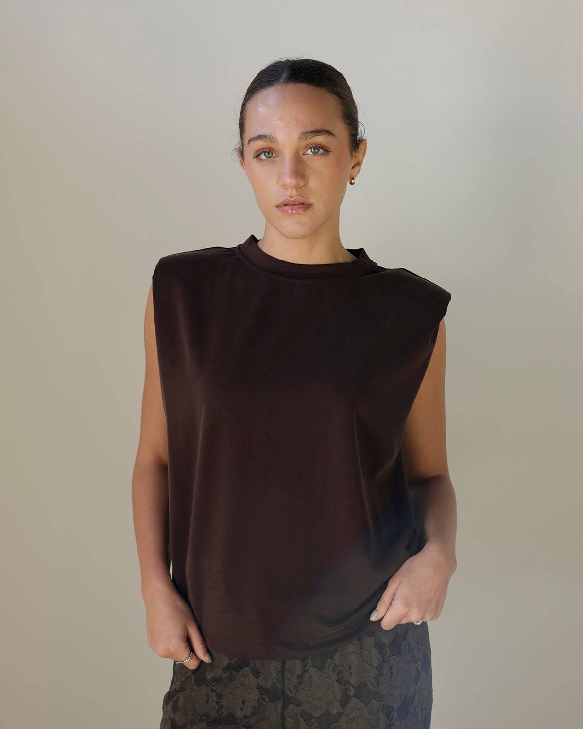 girl wearing  brown cut off Tshirt muscle tee with lace pants sleeveless top 