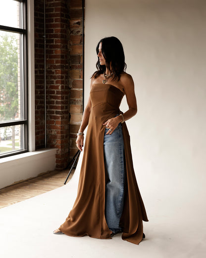 Camel strapless satin tunic with flowing side slits worn over blue jeans