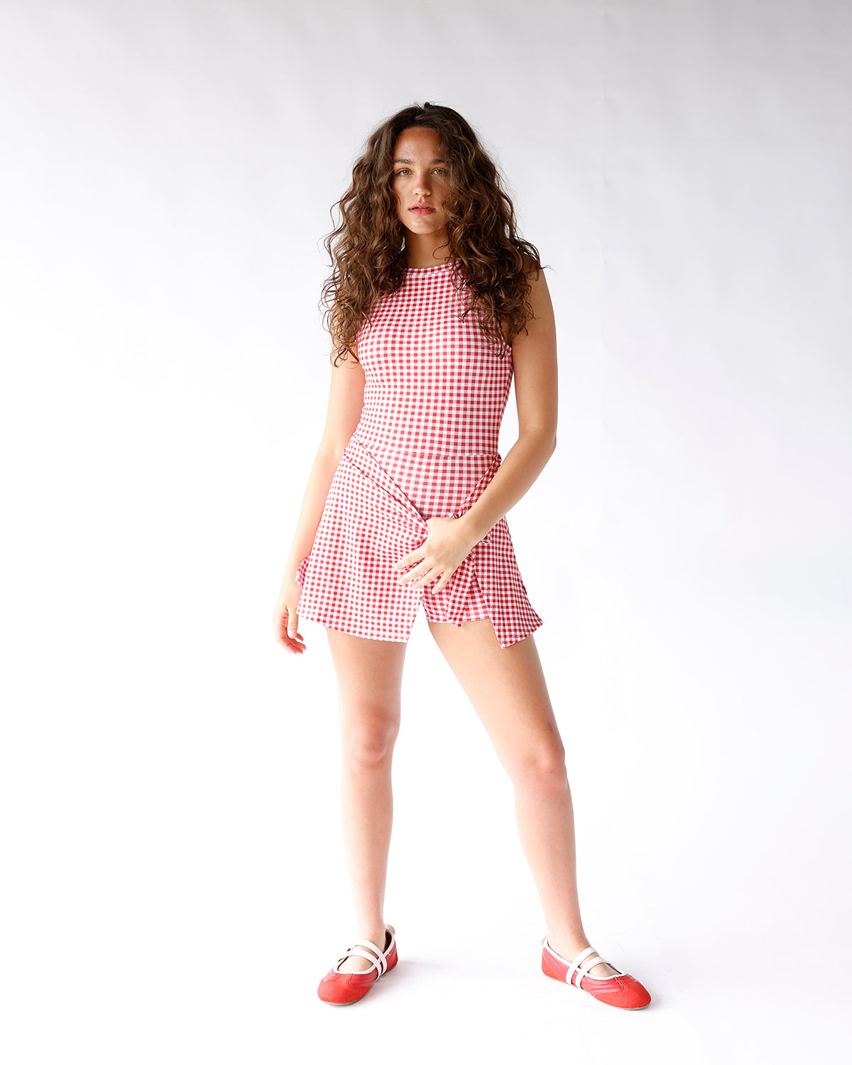 redand white gingham print active dress with waist tie detail and built in shorts
