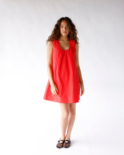 Red sleeveless mini dress with gathered scoop neckline and A-line silhouette