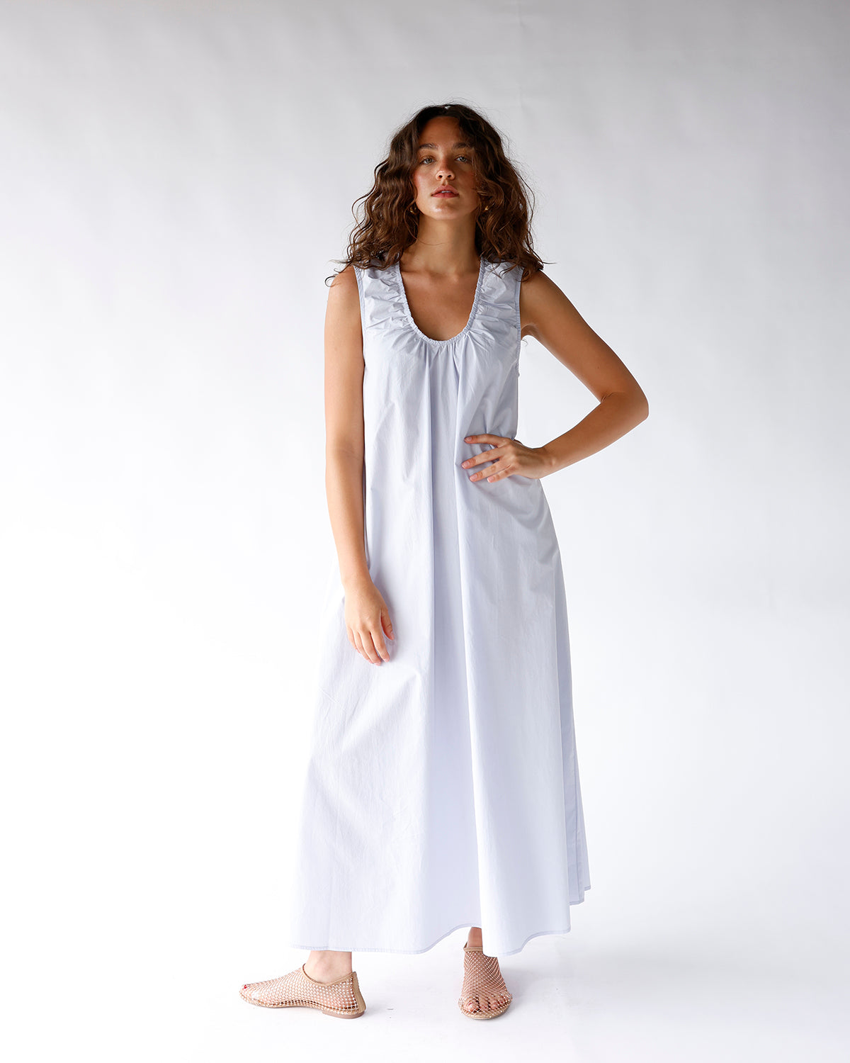 light blue sleeveless maxi dress with low scoop neckline