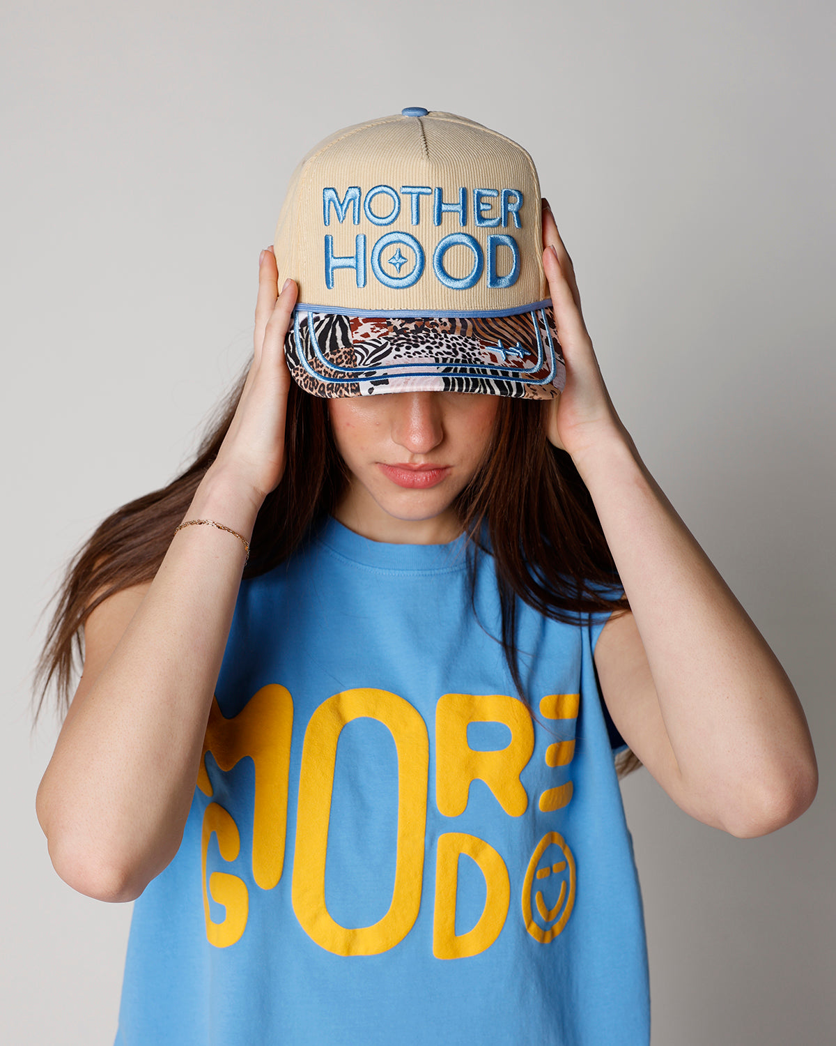 yellow corduroy motherhood trucker hat with animal print bill motherhood trucker hat