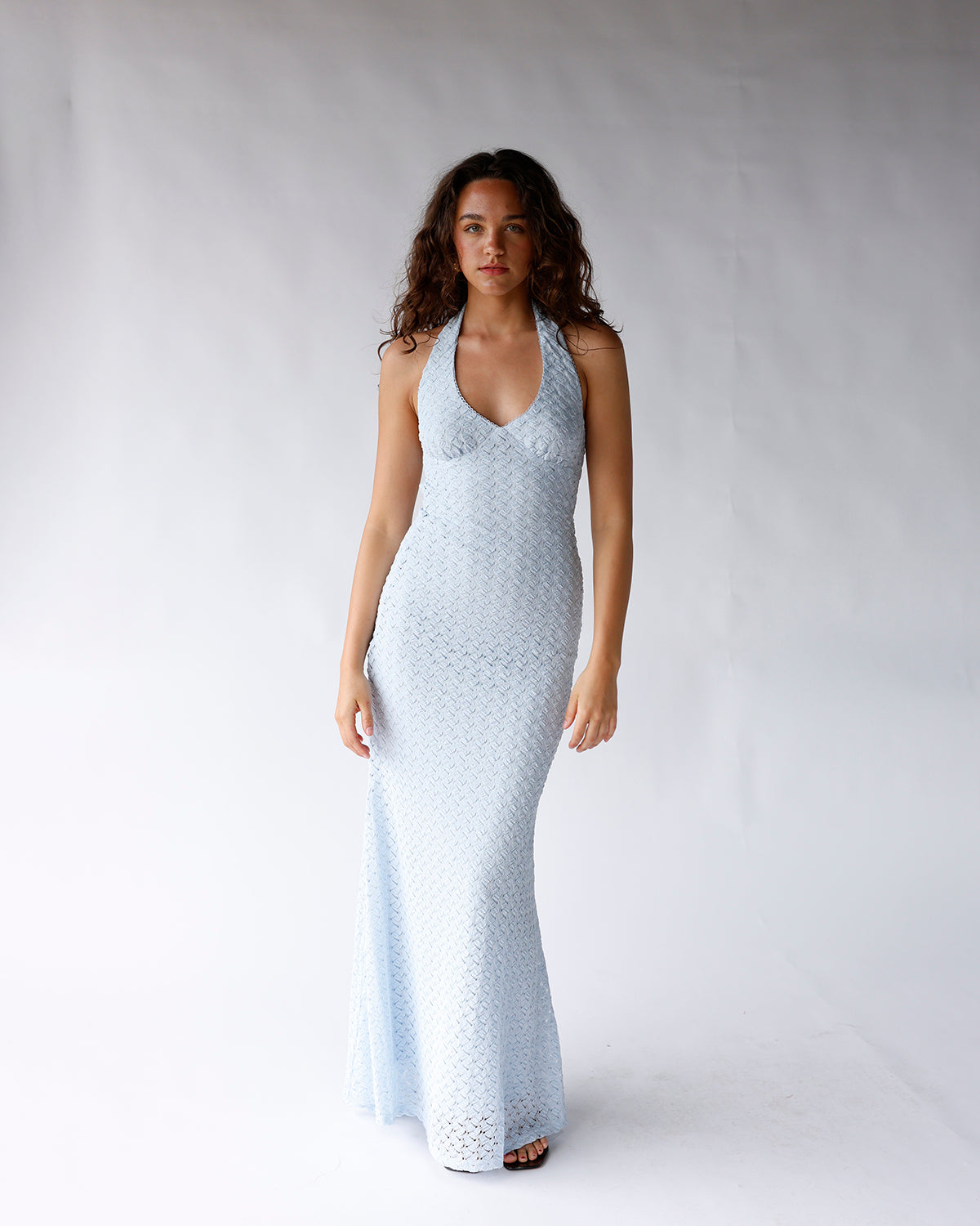 nia pluma dress light blue halter maxi dress with deep v-neckline and body skimming silhouette