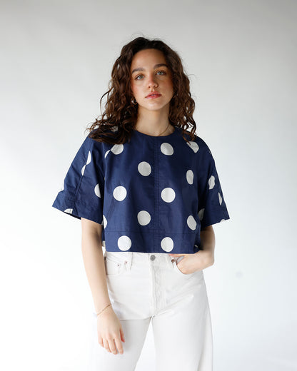navy blue and white polka dot short sleeve back tie detail top