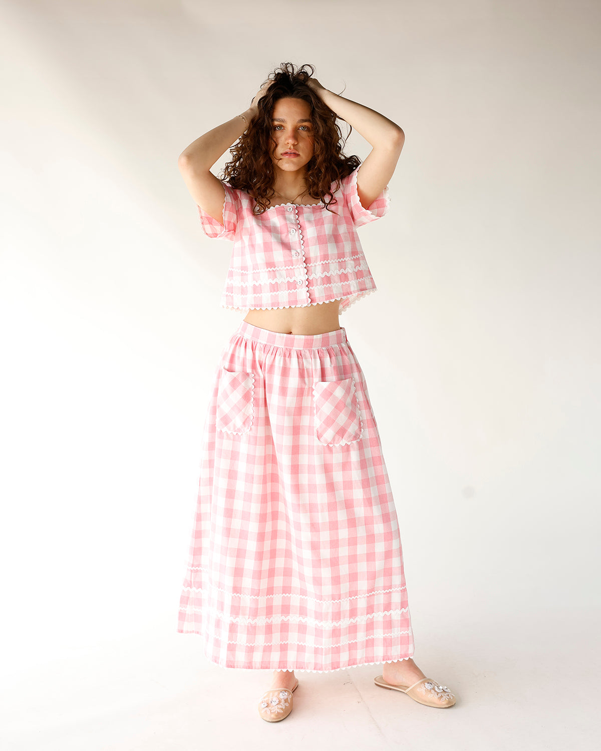 pink and white gingham print midi skirt with front pocket and scallop trim detailing