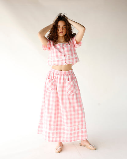 pink and white gingham print midi skirt with front pocket and scallop trim detailing