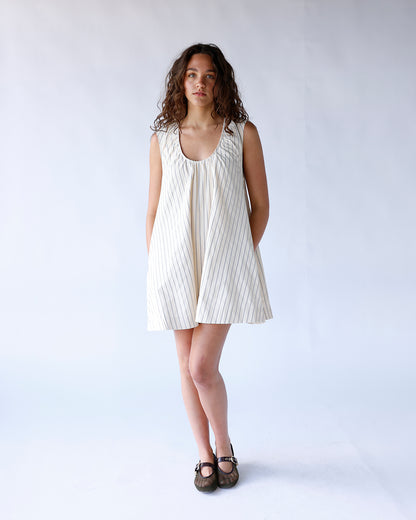 Cream pinstripe sleeveless mini dress with scoop neck and A-line silhouette