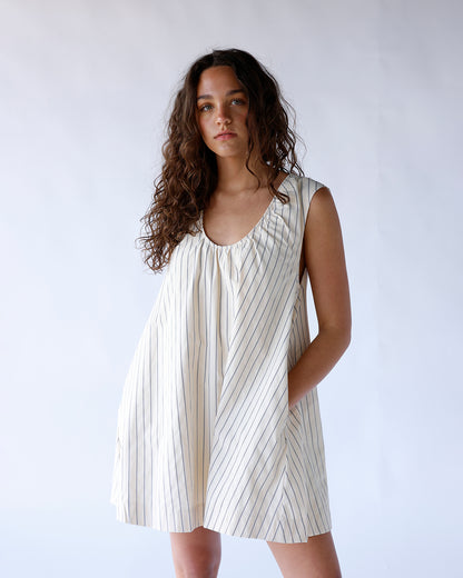 Cream striped sleeveless mini dress with gathered neckline and relaxed silhouette