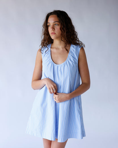 Light blue striped sleeveless mini dress with scoop neck and flared silhouette