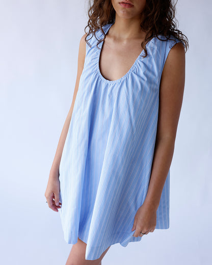 Light blue striped sleeveless mini dress with gathered scoop neckline and flowy silhouette
