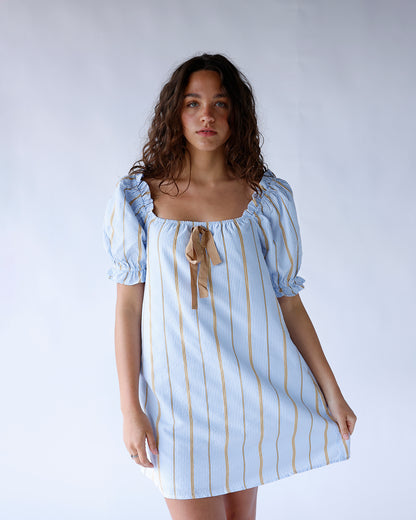Blue striped puff sleeve mini dress with square neck and tan tie detail