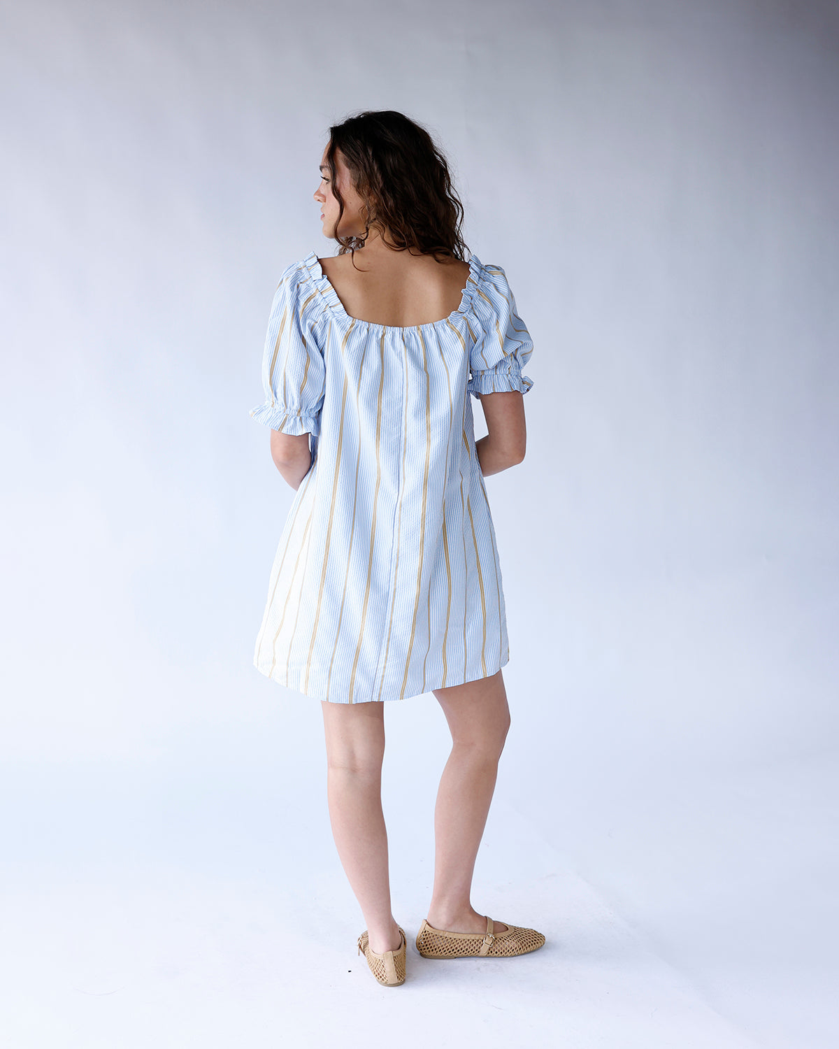 Light blue striped puff sleeve square neck mini dress with gold accents