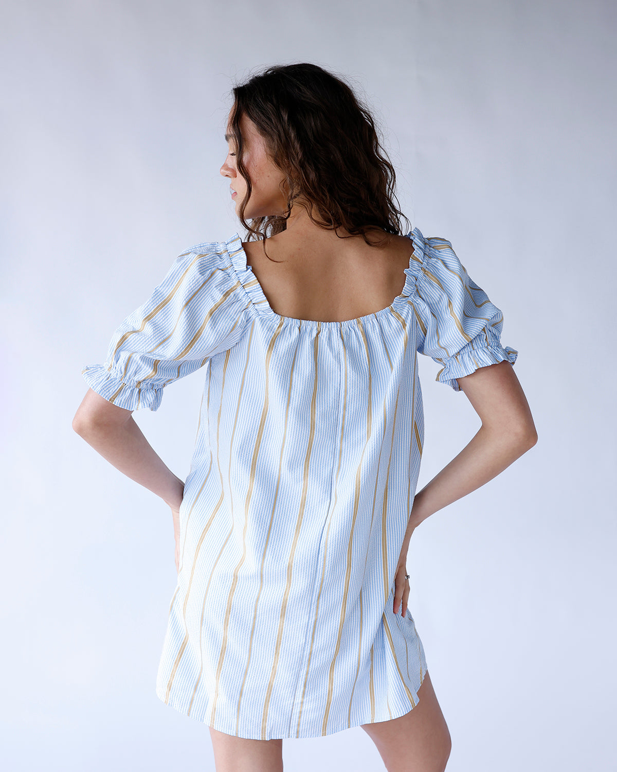 Striped blue and gold puff sleeve square neck mini dress, back view