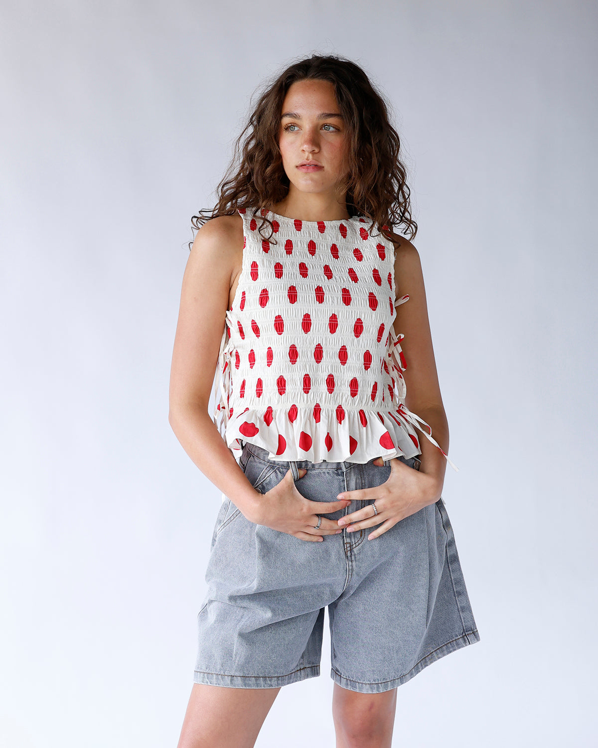 RED CONFETTI SLEEVELESS BLOUSE