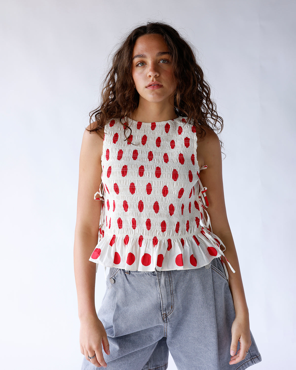 RED CONFETTI SLEEVELESS BLOUSE
