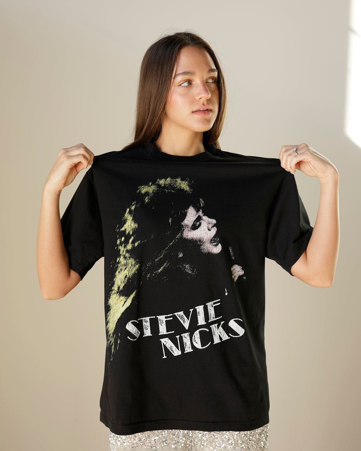 women's black stevie nicks graphic t-shirt featuring a distressed portrait print, vintage-inspired lettering, crew neckline and relaxed oversized silhouette.