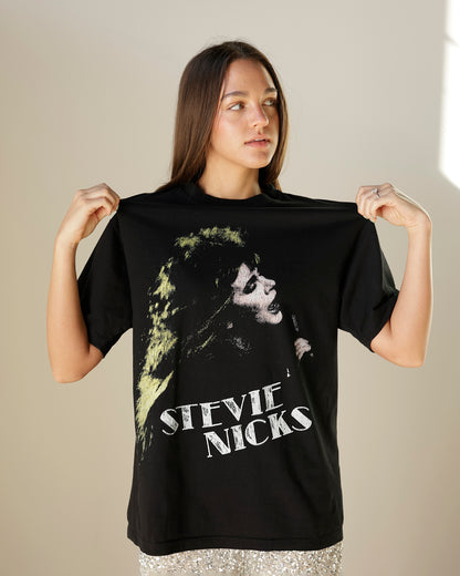 women's black stevie nicks graphic t-shirt featuring a distressed portrait print, vintage-inspired lettering, crew neckline and relaxed oversized silhouette.