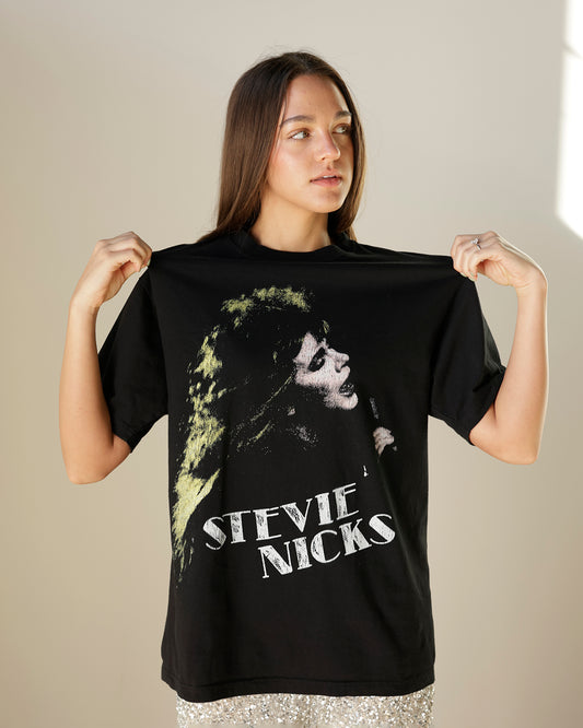 women's black stevie nicks graphic t-shirt featuring a distressed portrait print, vintage-inspired lettering, crew neckline and relaxed oversized silhouette.