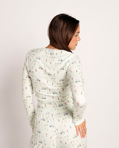 Women's white long-sleeve top and pants set with golf print pattern, back view