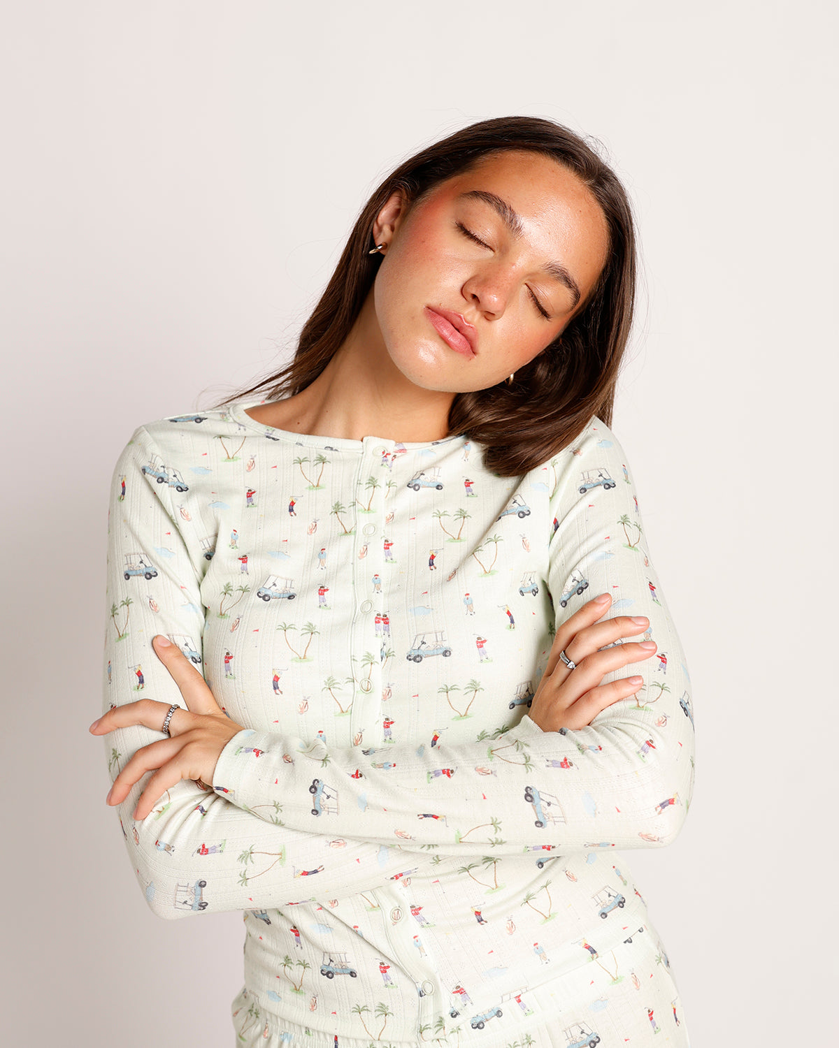 Women's light green long-sleeve henley top with golf print pattern