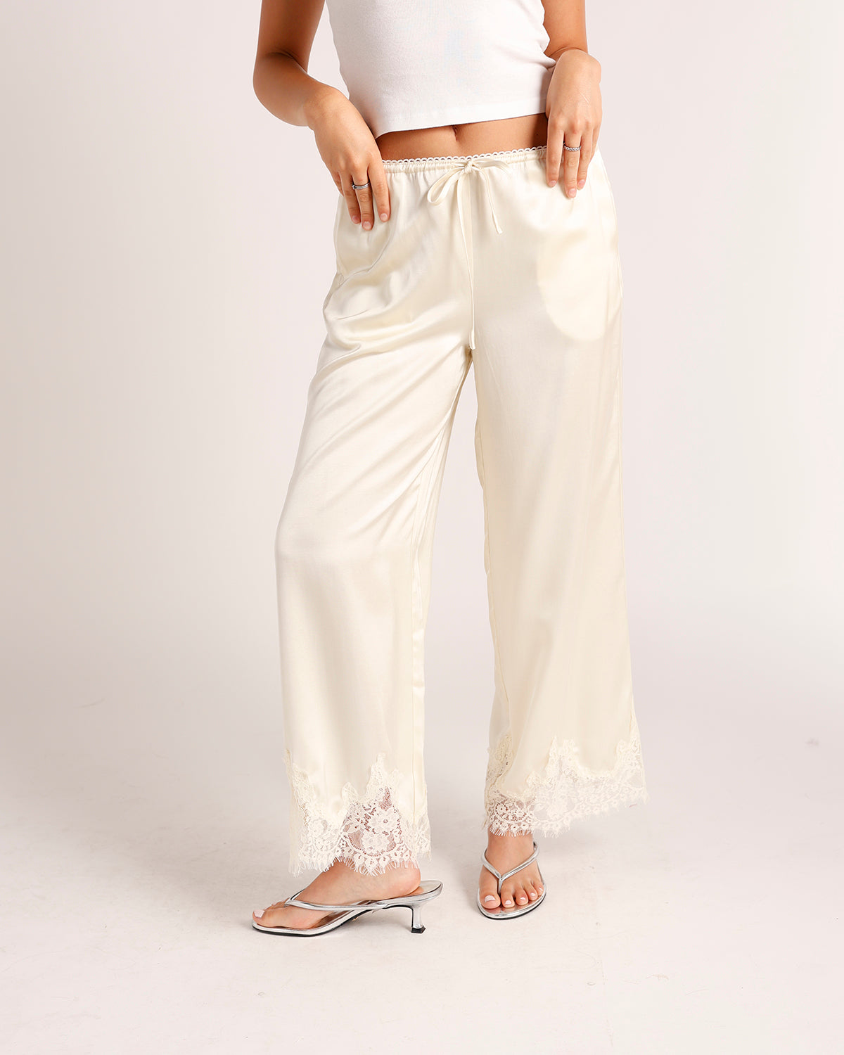 ivory satin pants with lace trim hem