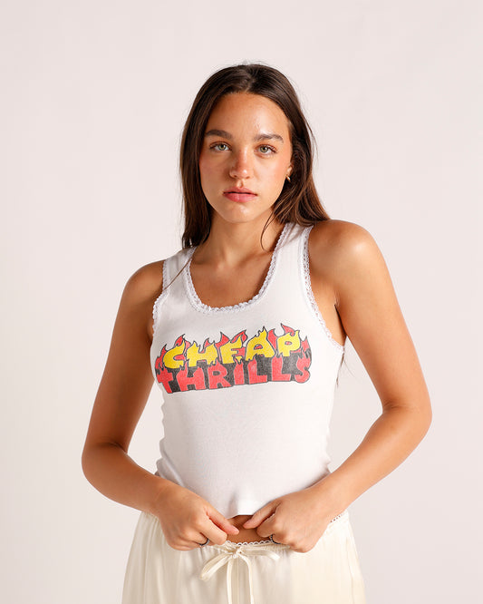 White sleeveless tank top with flame graphic print reading Cheap Thrills, lace trim