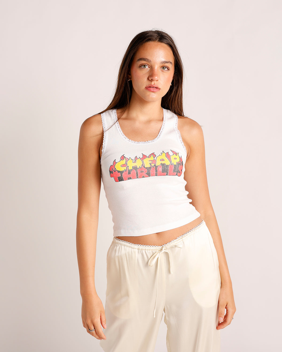 White crop tank top with flame graphic print and lace trim details